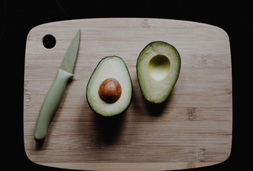 Paring knife with spear tip used to slice avocado