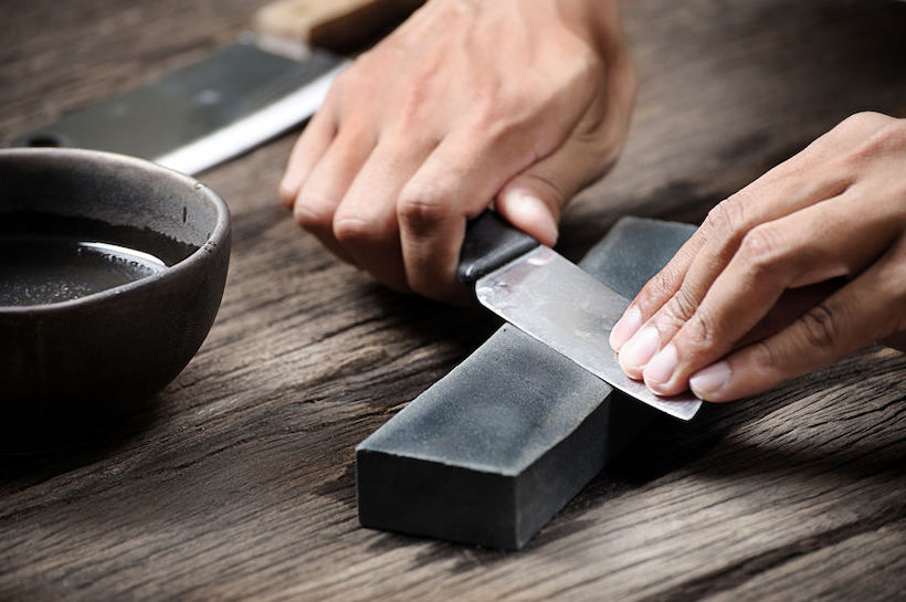 Sharpen knife with a whetstone