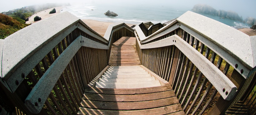 Staircase down to the beach with wooden rails