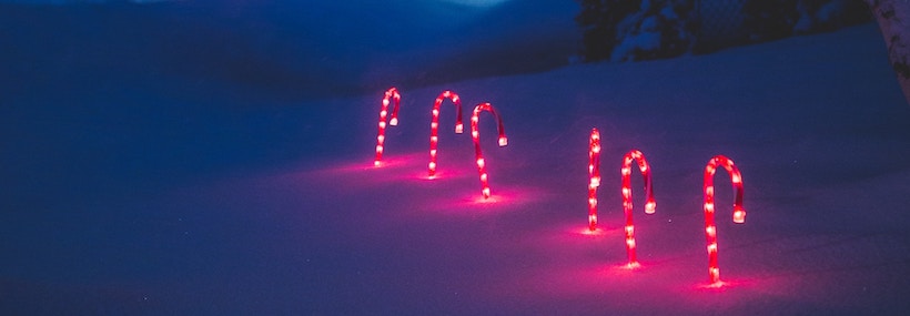 6 Candy Cane lawn ornaments in the snow