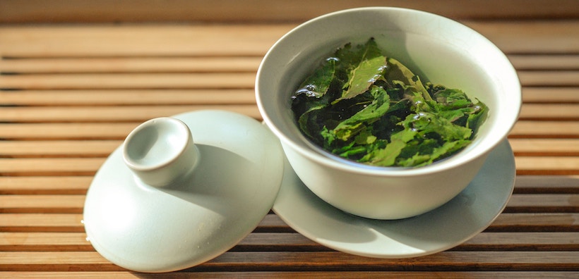 Green tea leaves in mug