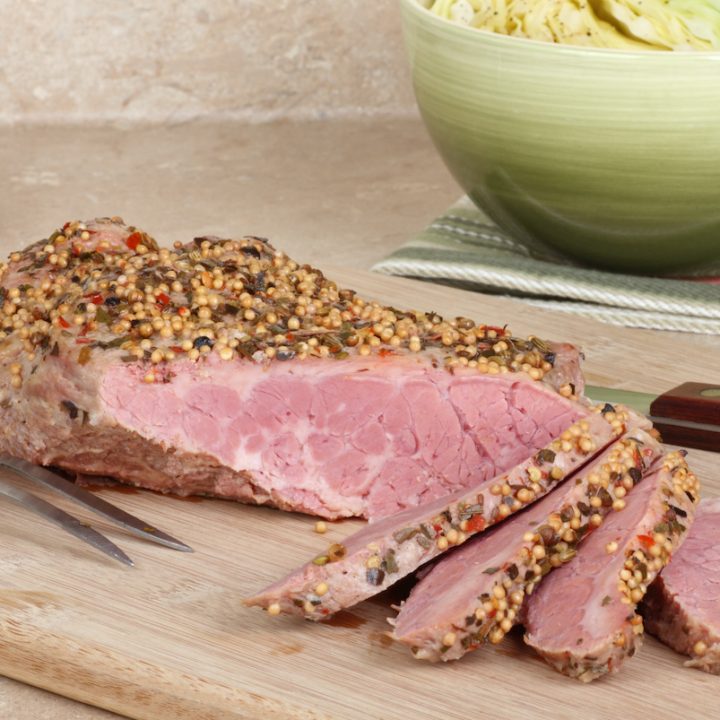 Corned beef brisket sliced on a cutting board