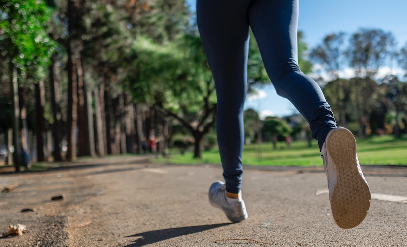 Behind shot of a jogger running on a trail