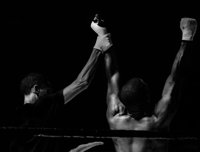 Ref raises a fight winner's hands