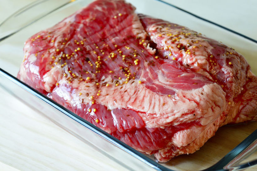 Fresh corned beef in a glass pan on Patrick day