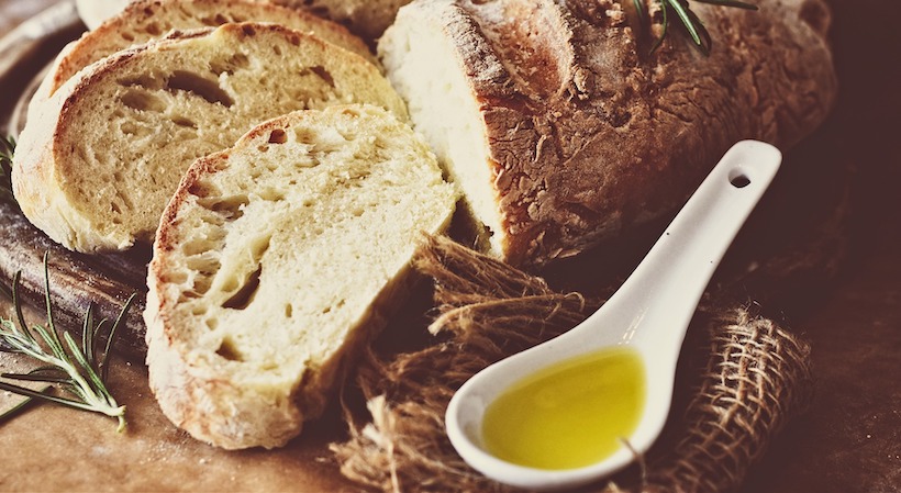 Loaf of bread and olive oil for dipping