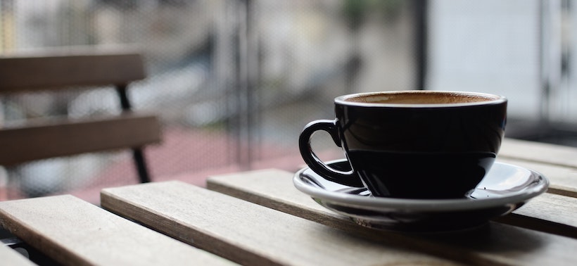 Outdoors view of a coffee cup with coffee