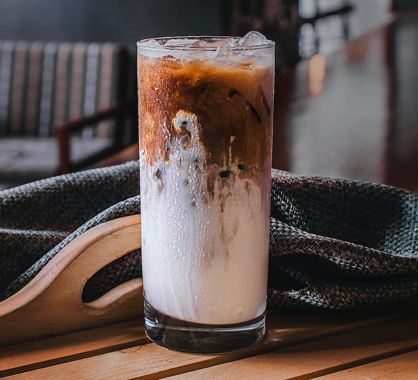 Milk mixing into cold brew coffee