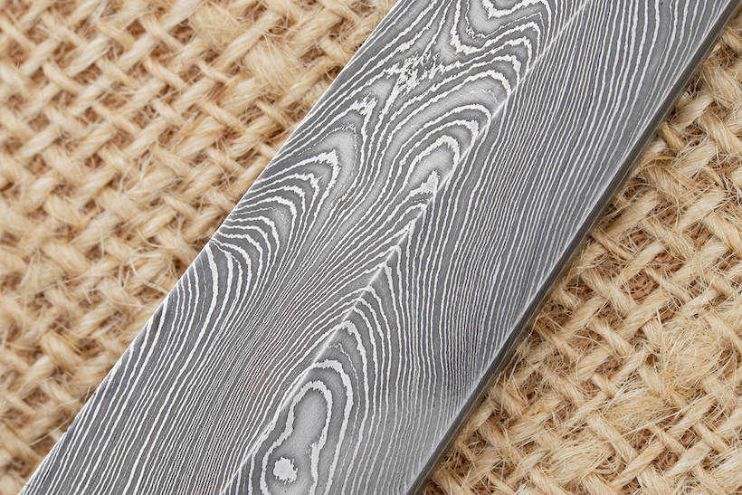 Traditional handmade Finnish knife blade made of damascus steel.