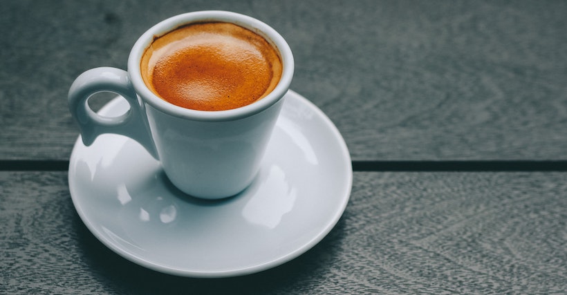 Ceramic white mug with espresso inside