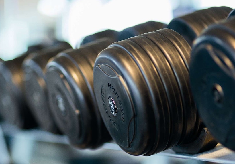 Rack foll of rubber dumbbells