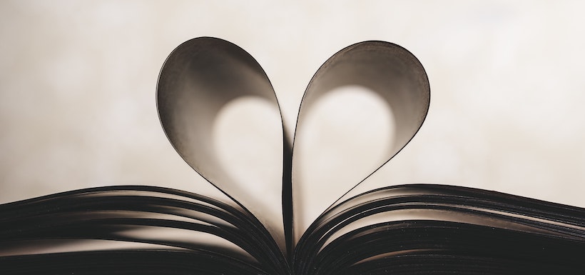 Book pages curled into a heart