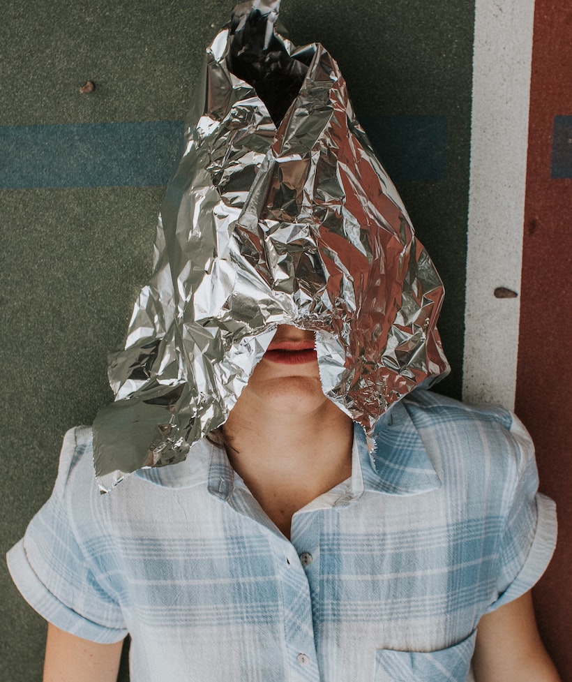 Lady wearing an aluminum or tin foil hat