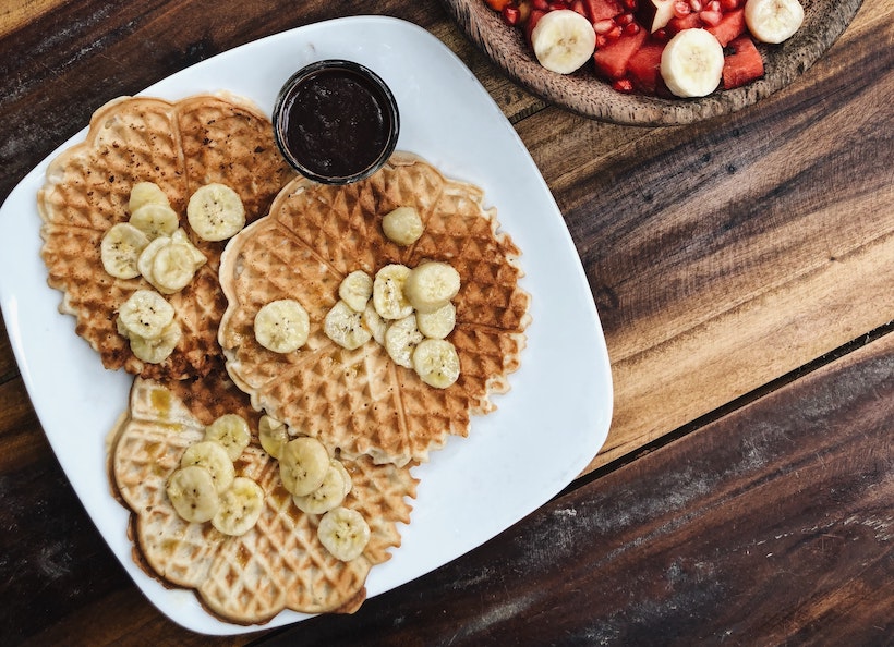 Waffles with bananas on top