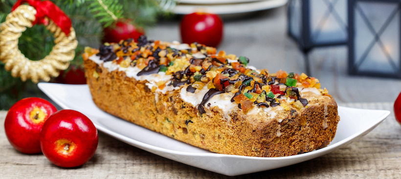 Fruitcake with dried fruits and nuts in christmas setting