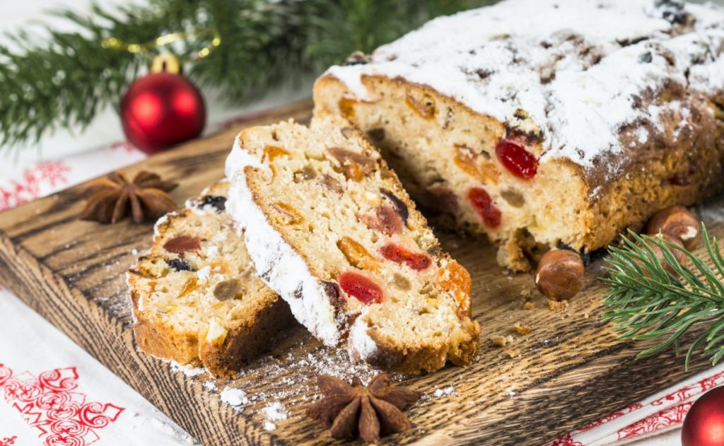 Stollen on a cutting board with seasonal decorations