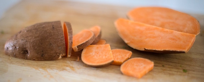 Sweet potato sliced on cutting board