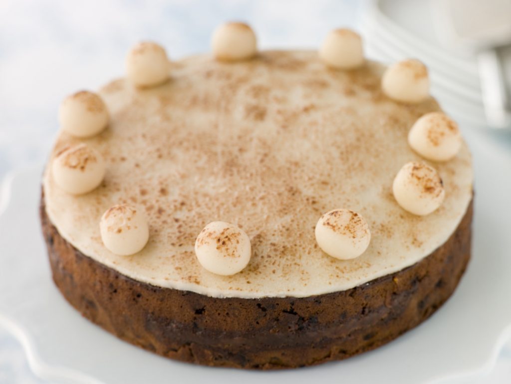 Whole simnel cake half in focus