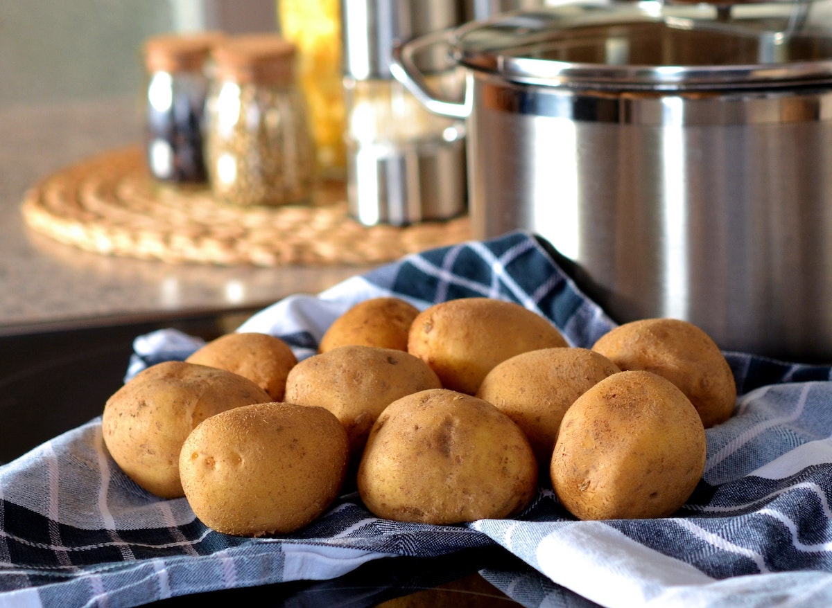 Potatoes next to a stock pot